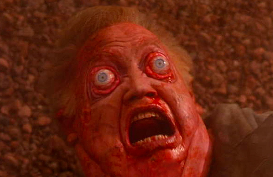 Vilos Cohaagen in the original Total Recall, with a bloated, bloody face and bulging eyes, as he experiences decompression.