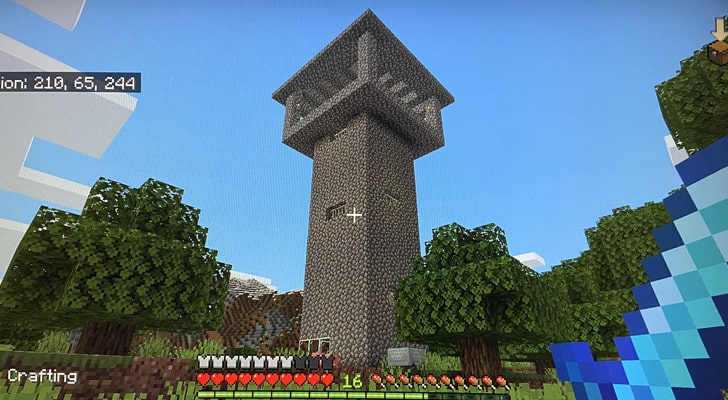 A tall cobblestone tower in Minecraft.
